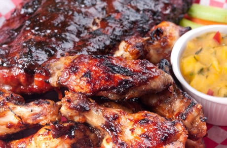 Sticky peri-peri chicken and ribs with mango salsa recipe